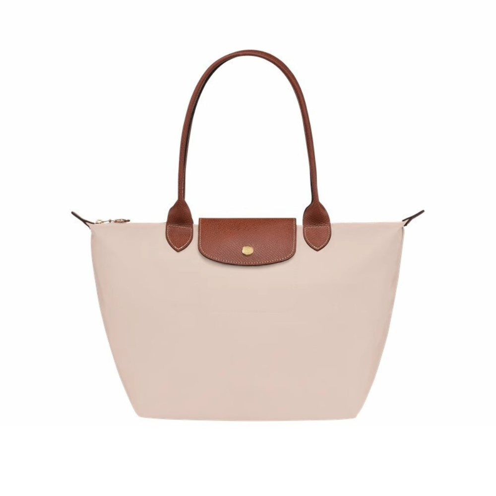 Bolso Longchanp Le Pliage con accesorios de viaje en su interior