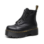 Botines de piel auténtica con plataforma gruesa para mujer en color negro, vista frontal.