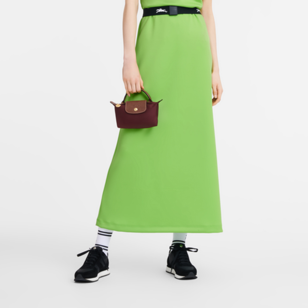 Detalle del interior organizado del bolso bandolera Longchamp Élan Mini con compartimentos inteligentes.
