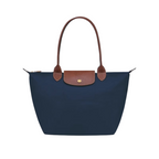 Bolso Longchanp Le Pliage en color rosa frambuesa, vista lateral