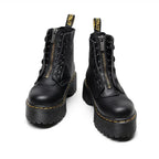 Botines de piel para mujer con plataforma robusta, imagen de detalle del material y acabado.