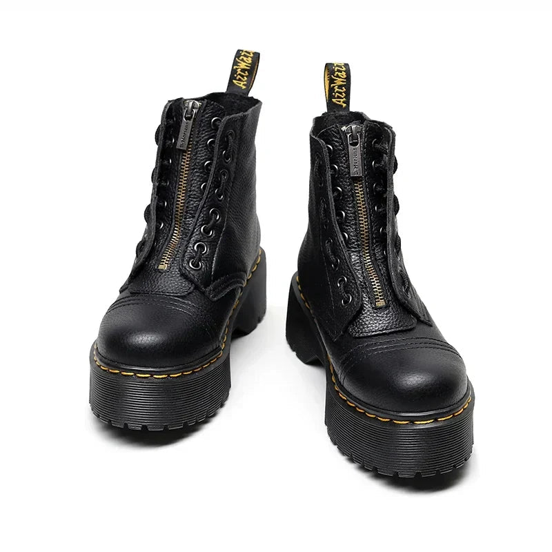 Botines de piel para mujer con plataforma robusta, imagen de detalle del material y acabado.