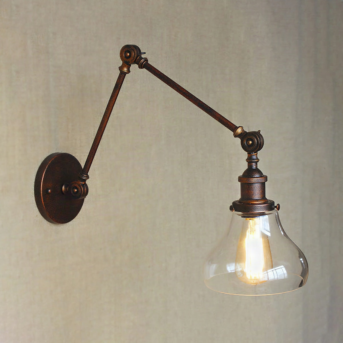 Aplique de pared industrial con pantalla de cristal en forma de pera y brazo articulado