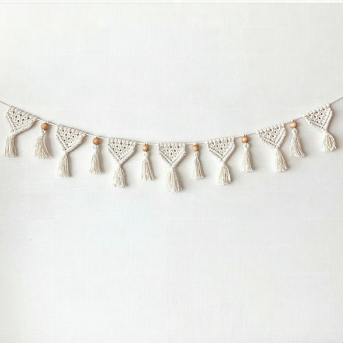 Guirnalda decorativa de macramé para pared