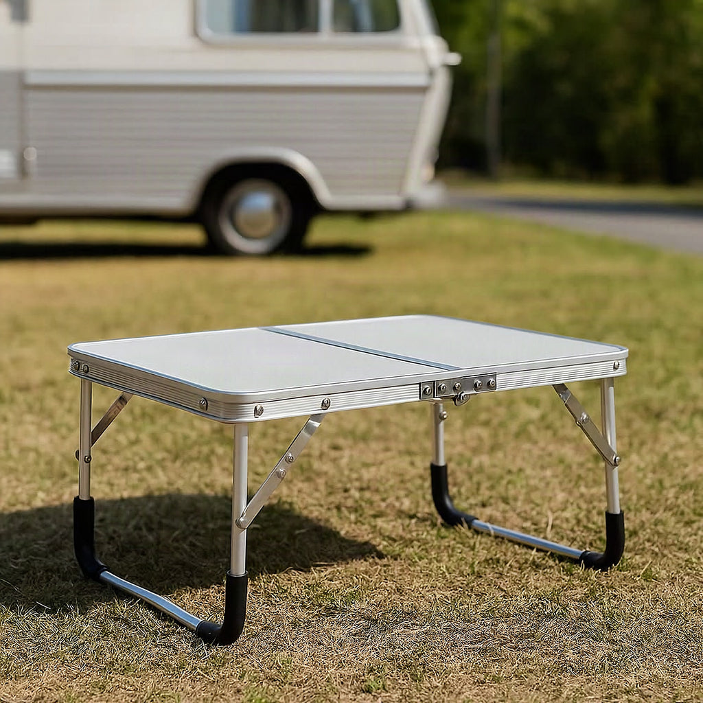 Mesa plegable de exterior en formato maleta para camping y balcón