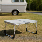 Mesa plegable de exterior en formato maleta para camping y balcón