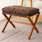 Taburete plegable con asiento acolchado y estructura de madera