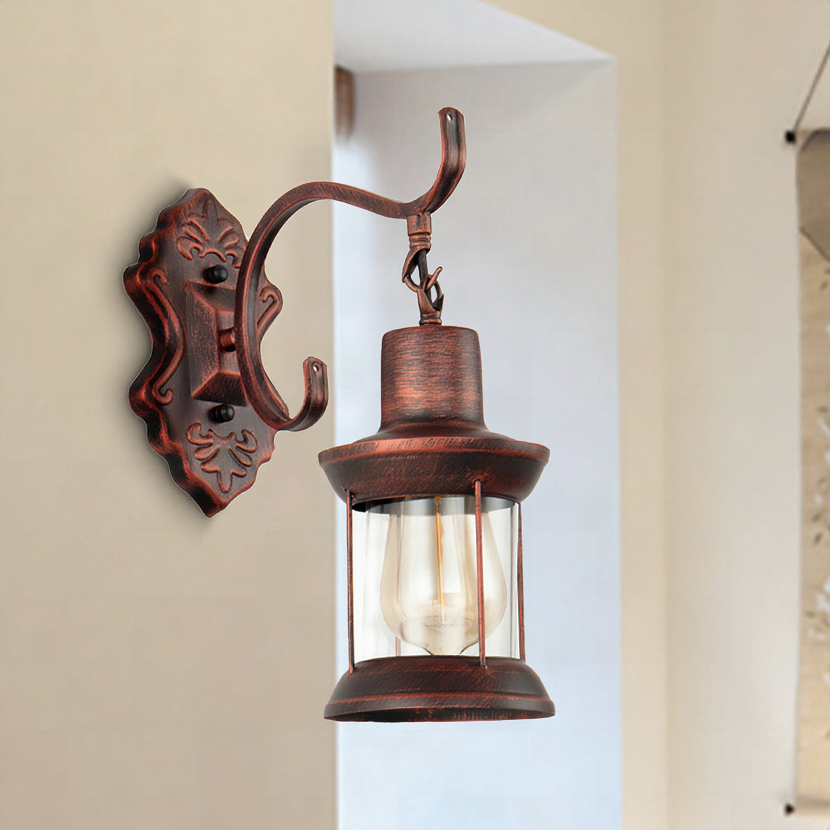 Aplique de pared estilo rústico con cristal transparente y acabado cobre envejecido