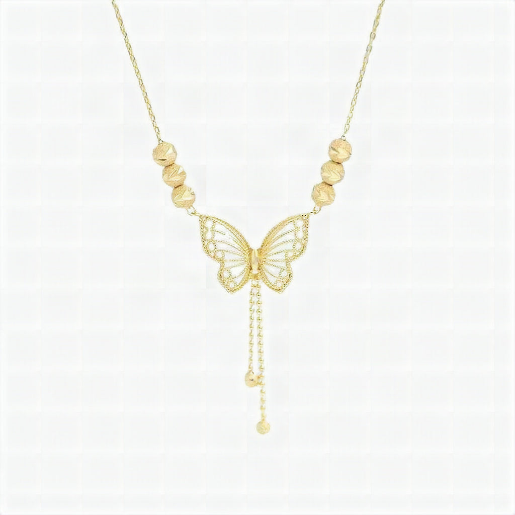 Collar con mariposa calada dorada y borlas