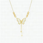 Collar con mariposa calada dorada y borlas