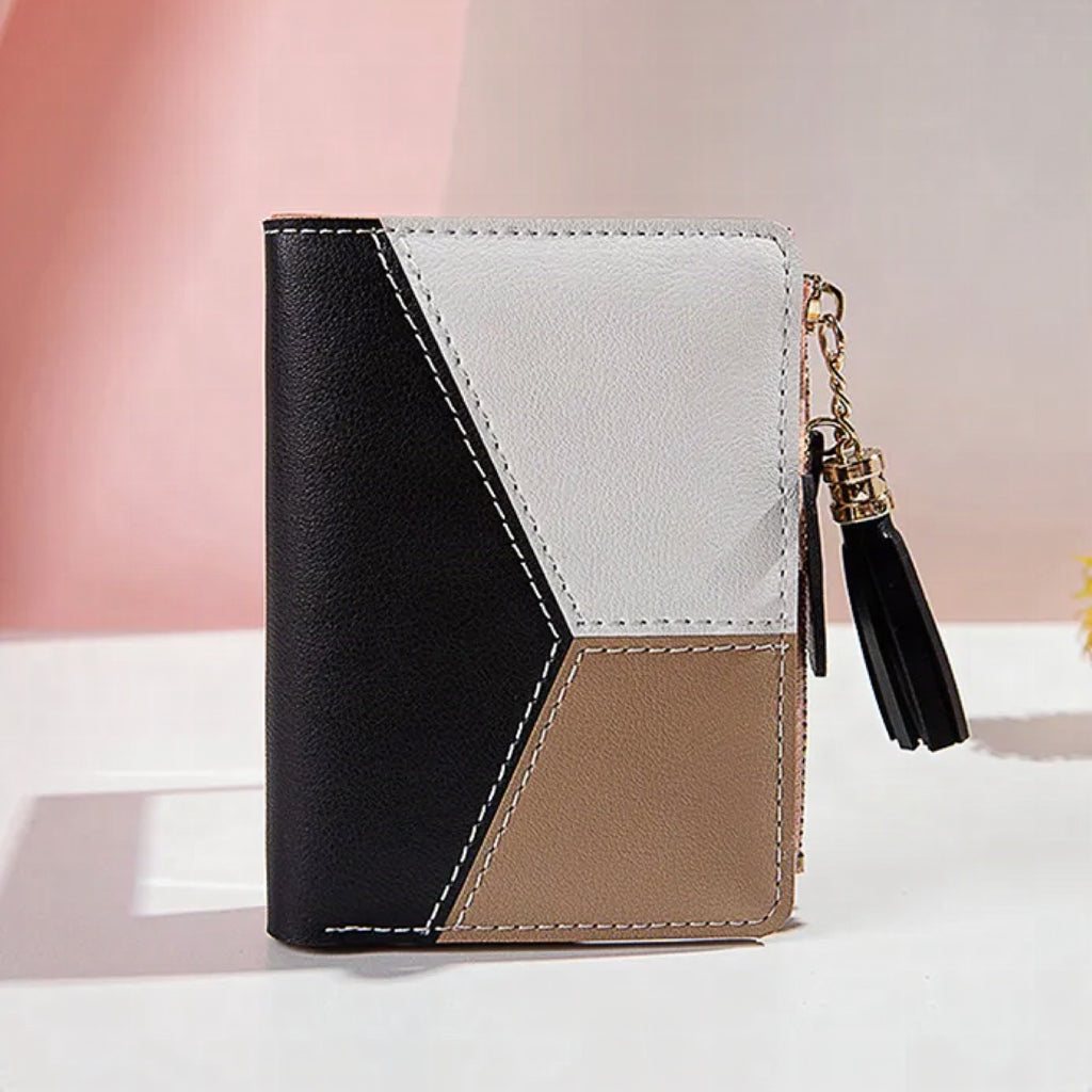 Monedero mini con borla decorativa