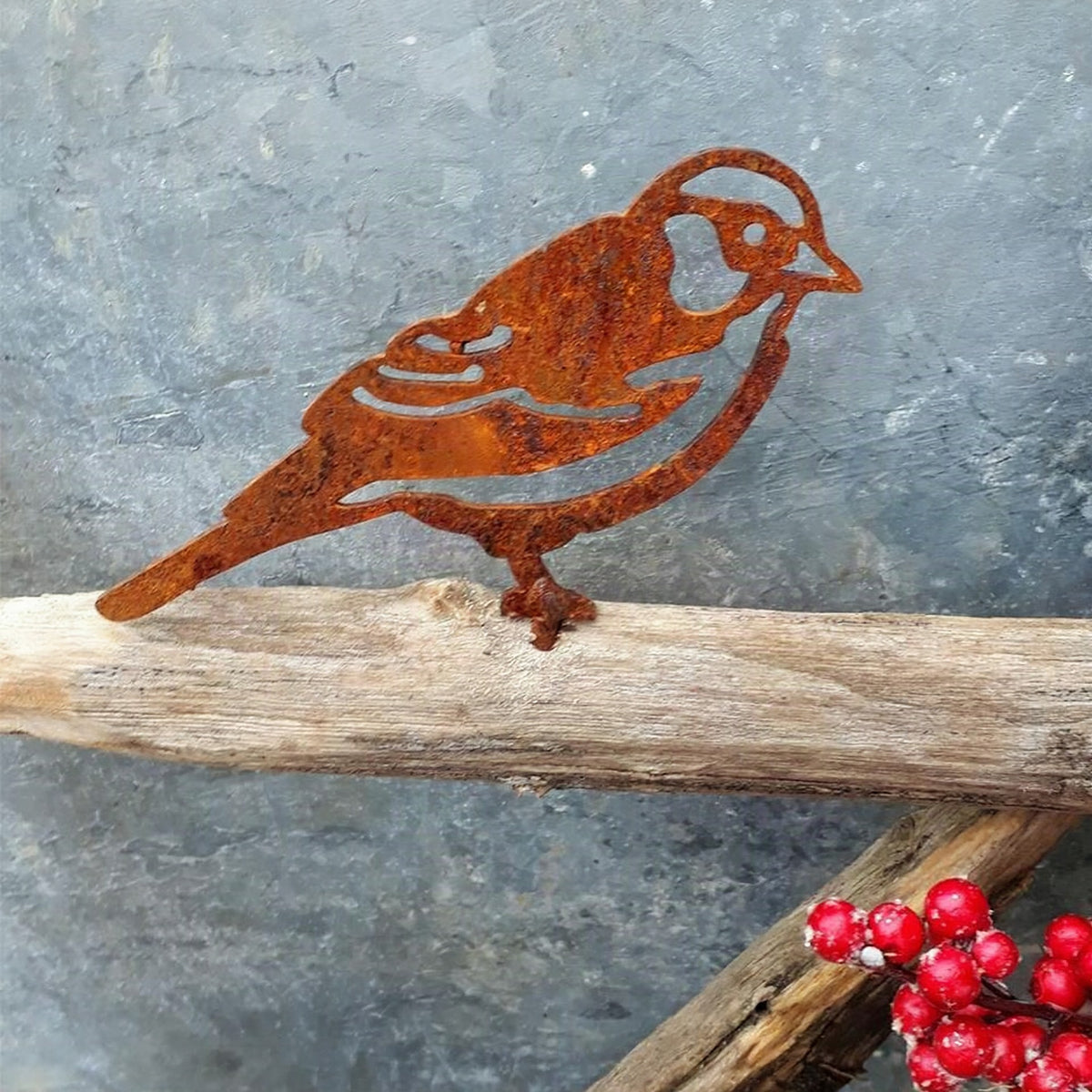Pájaro decorativo de metal con acabado rústico