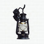 Aplique de pared estilo farol con cristal transparente, 1 luz, acabado negro o latón envejecido