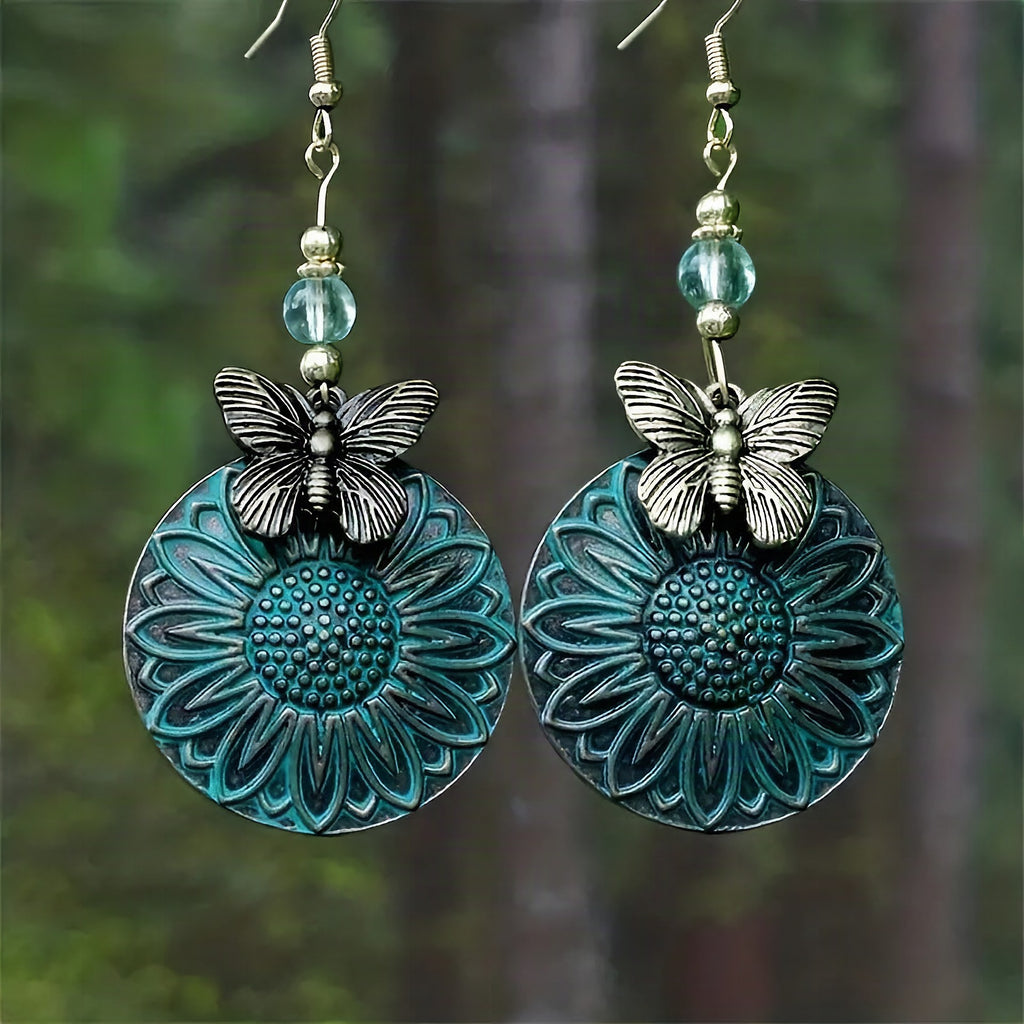Pendientes elegantes con motivo floral y mariposas