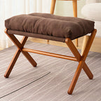 Taburete plegable con asiento acolchado y estructura de madera