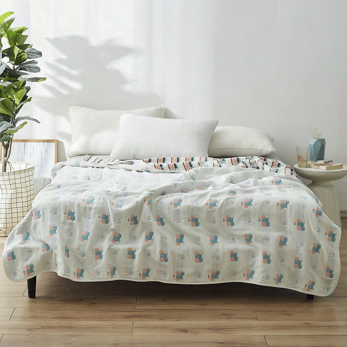 Manta elegante con sutil estampado de hojas