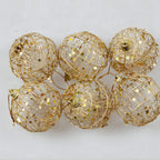 Bola de Navidad escamada con polvo dorado