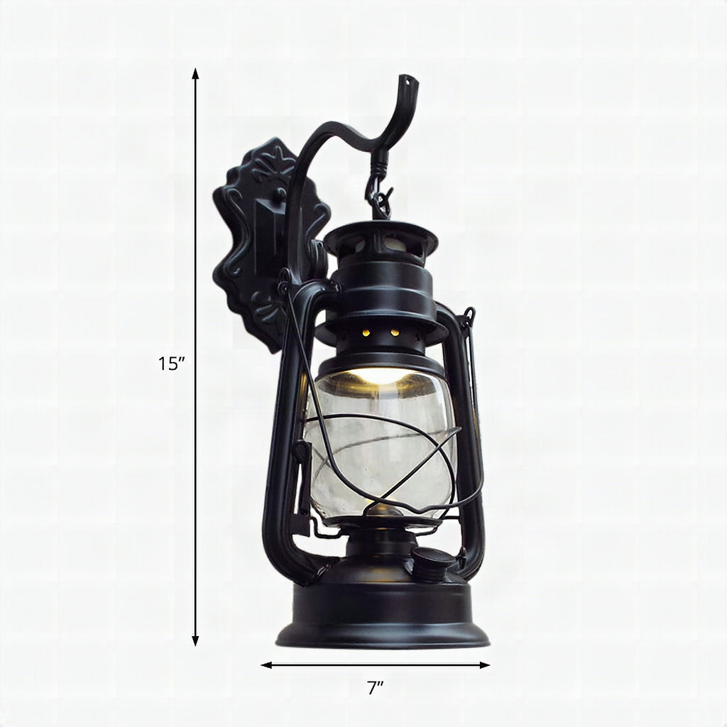 Aplique de pared estilo farol con cristal transparente, 1 luz, acabado negro o latón envejecido