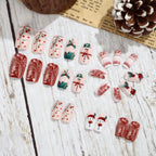 Set de uñas postizas navideñas con diseños festivos