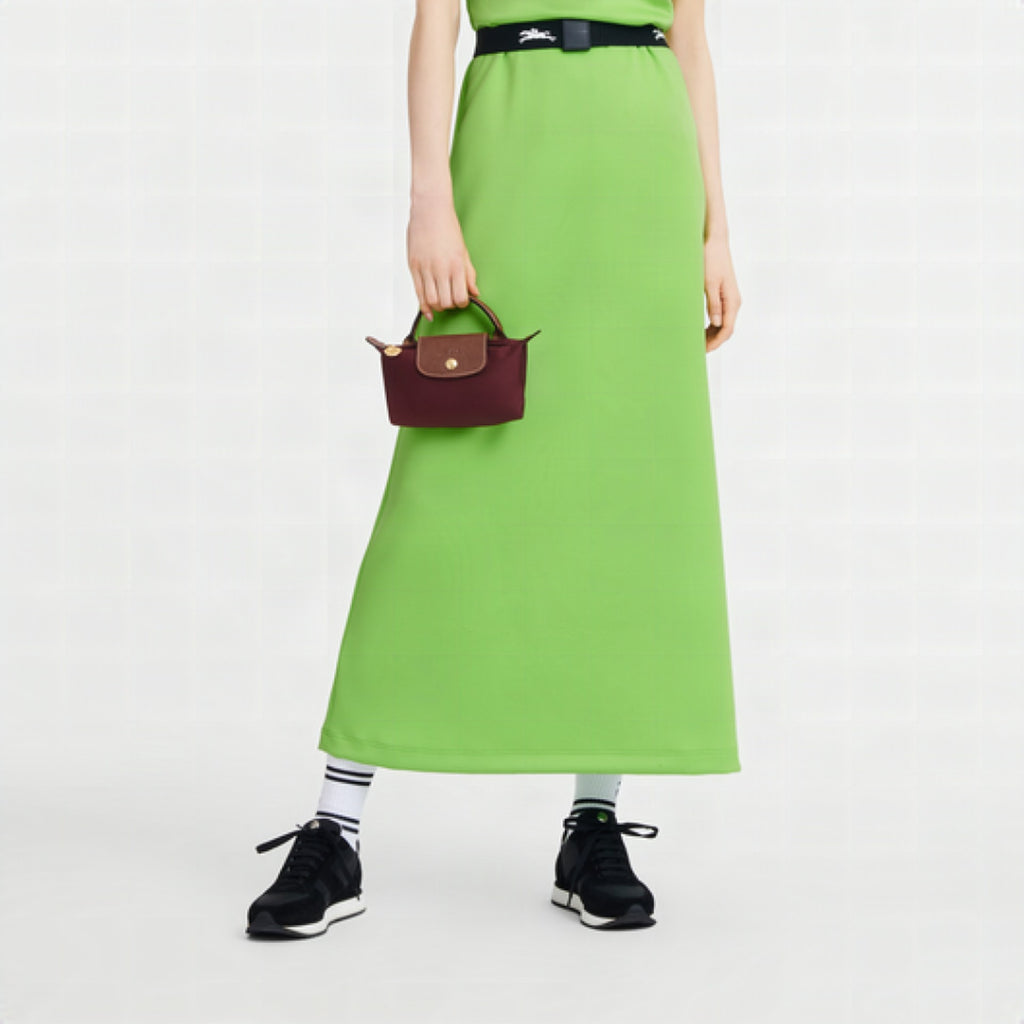 Detalle del interior organizado del bolso bandolera Longchamp Élan Mini con compartimentos inteligentes.