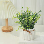 Planta artificial decorativa con maceta