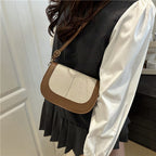 Bolso clutch estructurado con bandolera