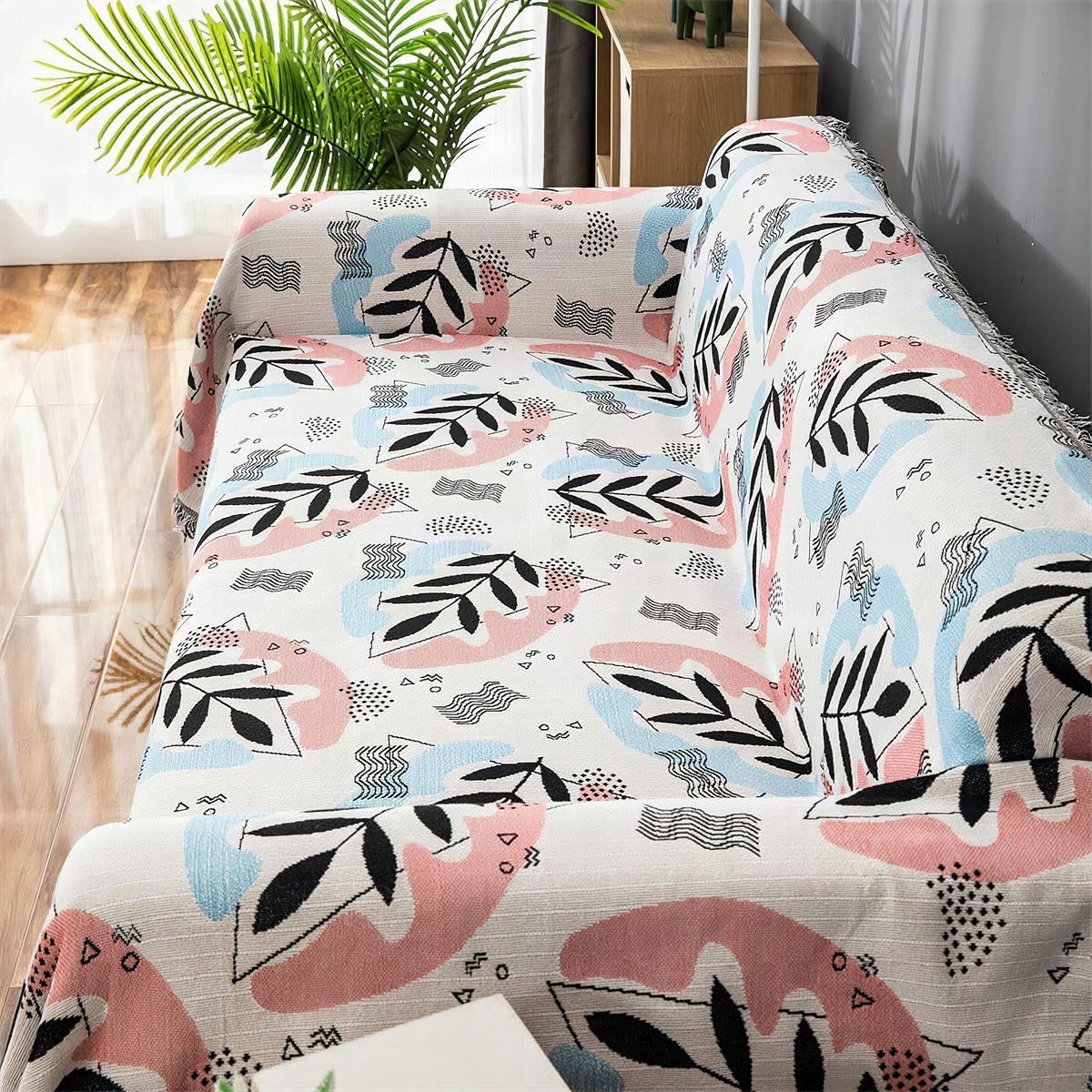 Funda protectora para sofá con estampado artístico de hojas