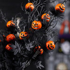 Rama decorativa de calabazas negras para Halloween