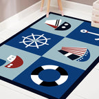 Alfombra infantil azul con coches, carreteras, anclas y timones