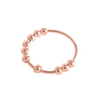 Anillo antiestrés giratorio de cuentas metálicas