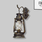 Aplique de pared estilo farol con cristal transparente, 1 luz, acabado negro o latón envejecido
