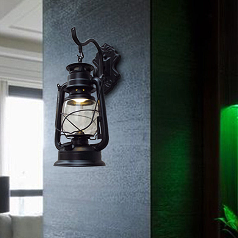 Aplique de pared estilo farol con cristal transparente, 1 luz, acabado negro o latón envejecido