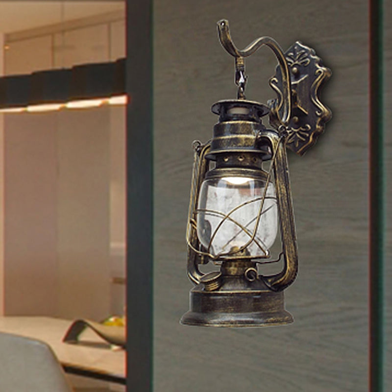 Aplique de pared estilo farol con cristal transparente, 1 luz, acabado negro o latón envejecido
