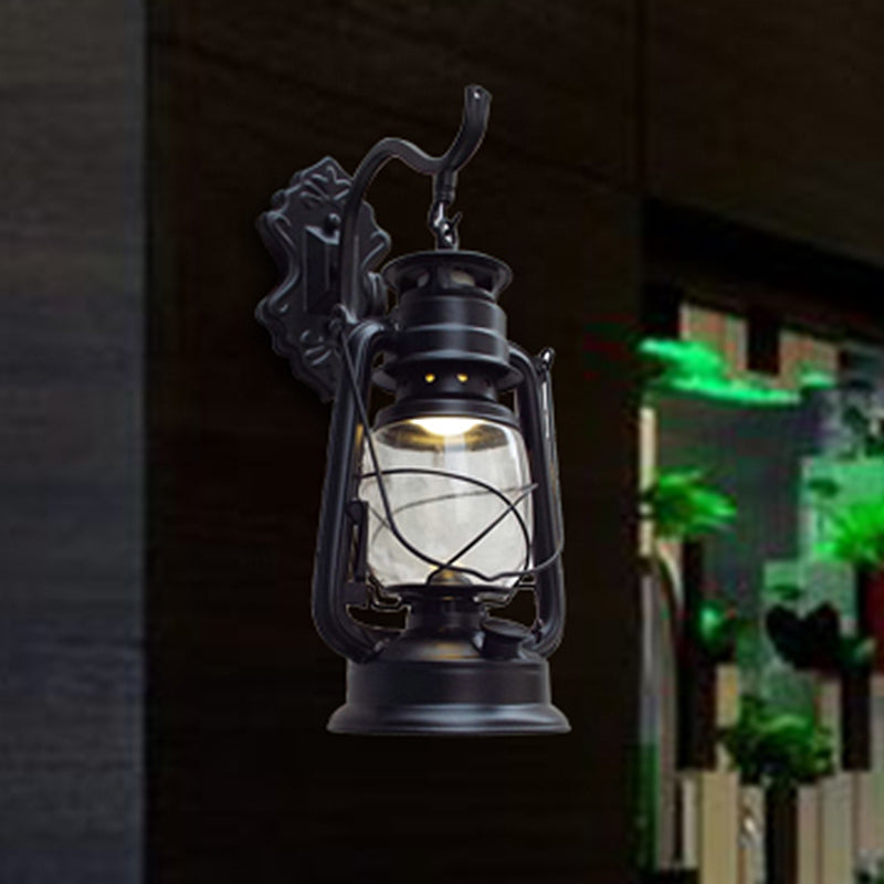 Aplique de pared estilo farol con cristal transparente, 1 luz, acabado negro o latón envejecido
