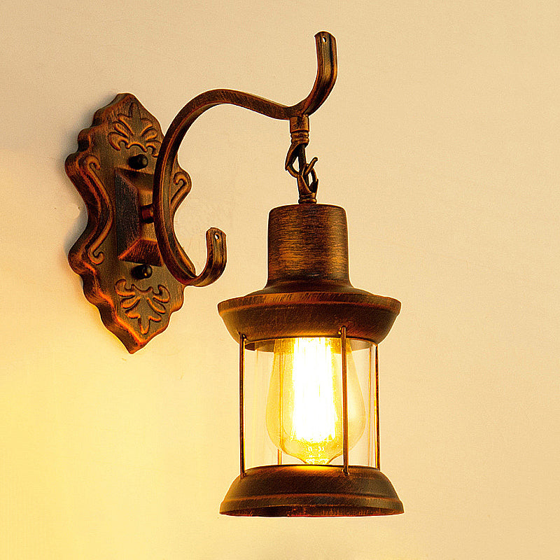 Aplique de pared estilo rústico con cristal transparente y acabado cobre envejecido