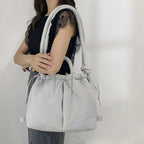 Bolso acolchado Riva con bandolera ajustable