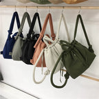 Bolso acolchado Riva con bandolera ajustable