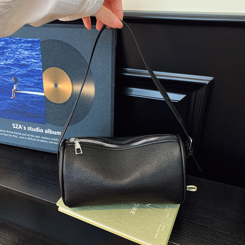 Bolso clutch bandolera con textura elegante
