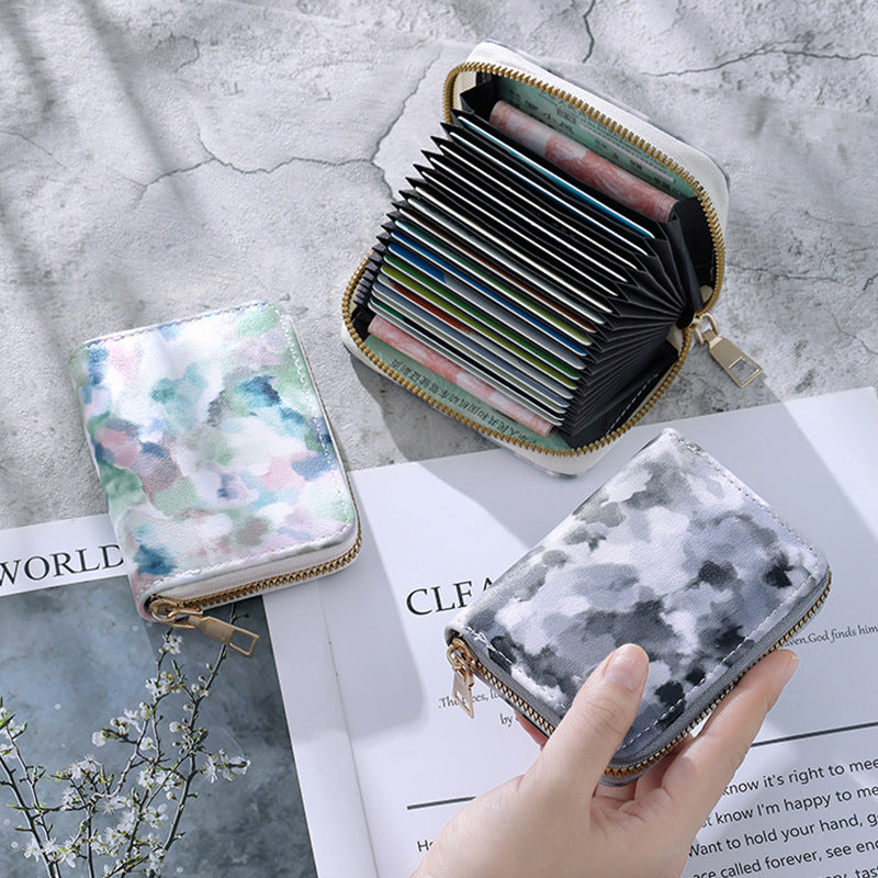 Cartera compacta con cremallera y estampado de camuflaje marmolado