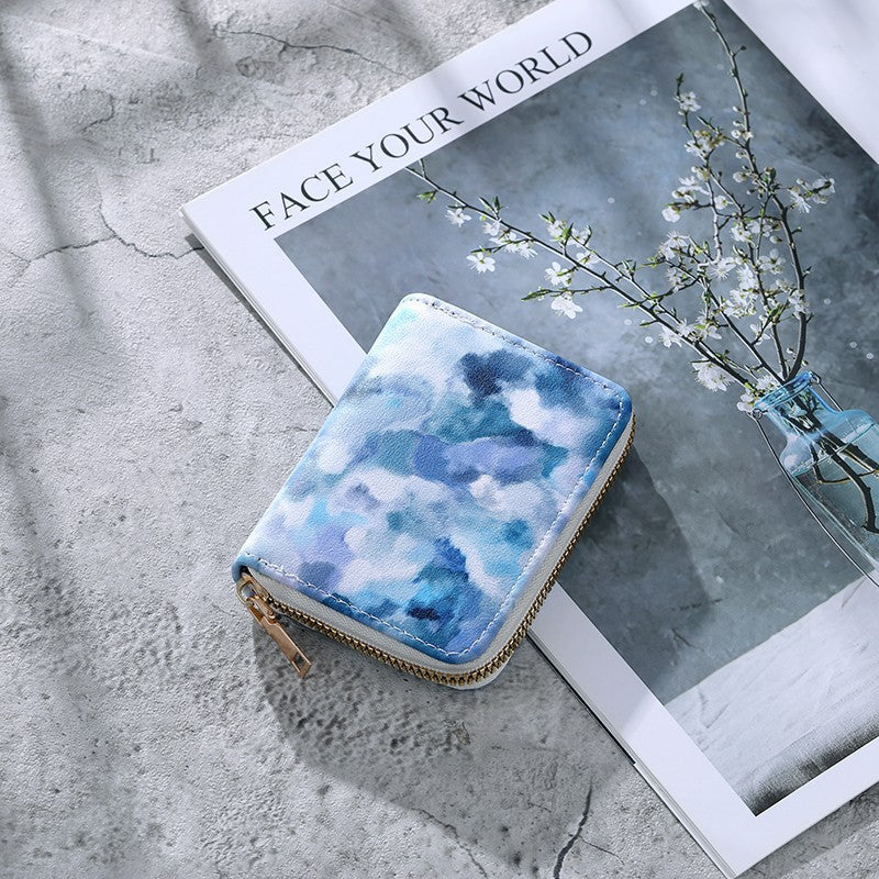 Cartera compacta con cremallera y estampado de camuflaje marmolado