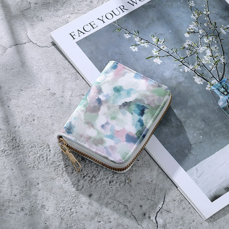 Cartera compacta con cremallera y estampado de camuflaje marmolado