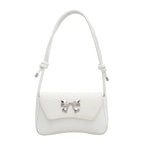 Clutch de mano con lazo decorativo