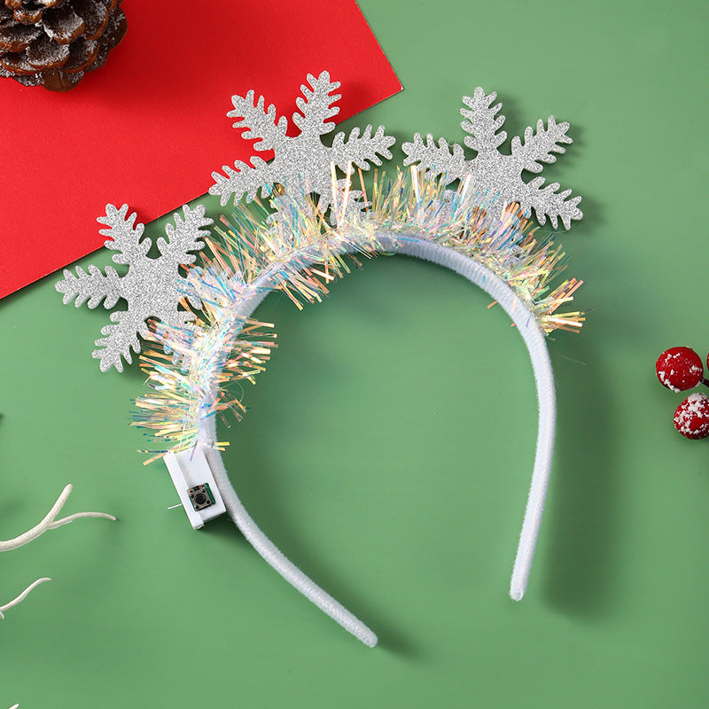 Diadema navideña luminosa con diseños festivos