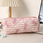 Estuche acolchado con estampado de lazos