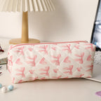 Estuche acolchado con estampado de lazos