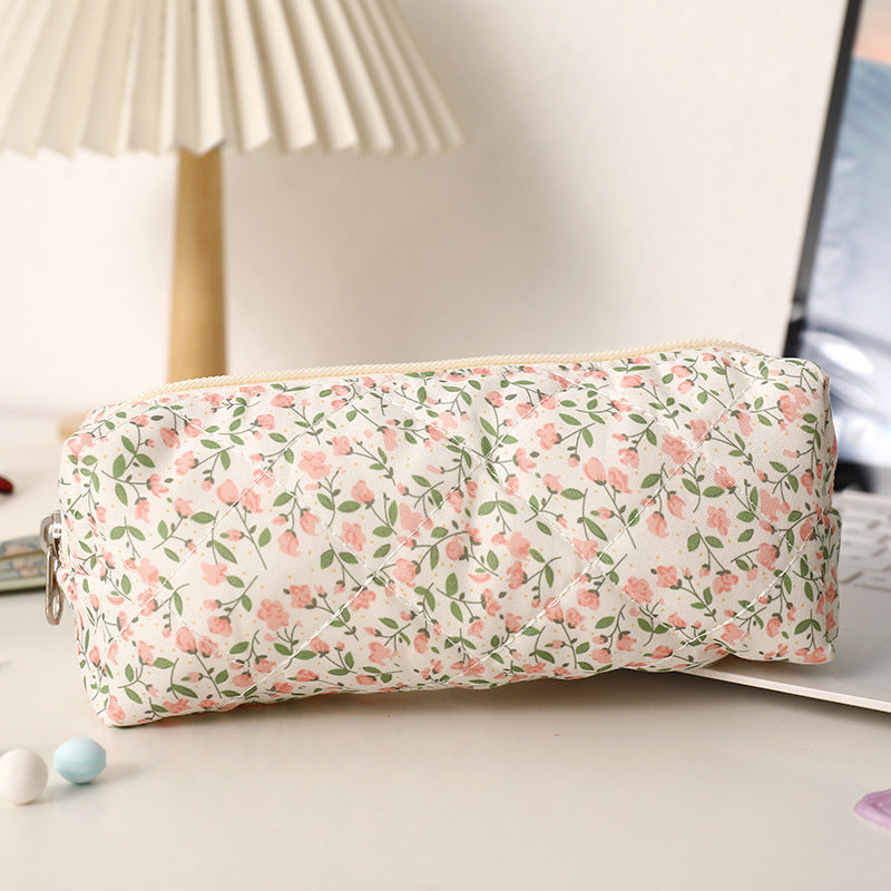 Estuche acolchado con estampado de lazos
