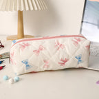 Estuche acolchado con estampado de lazos