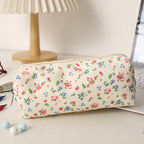 Estuche acolchado con estampado de lazos