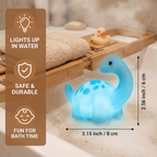 Juguete de baño dinosaurio luminoso con LED de colores para niños