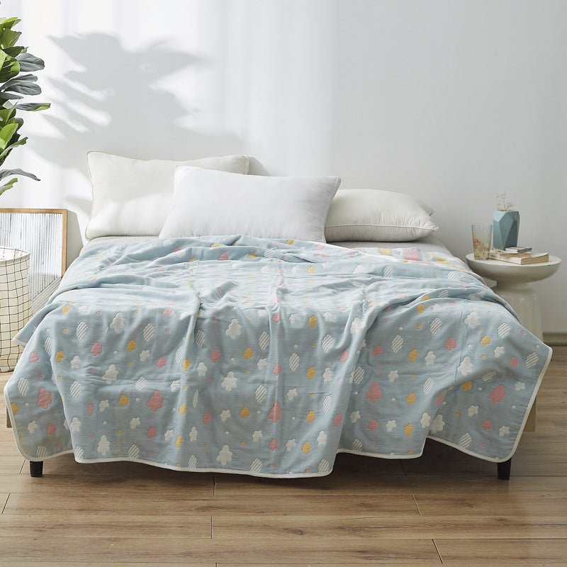 Manta elegante con sutil estampado de hojas
